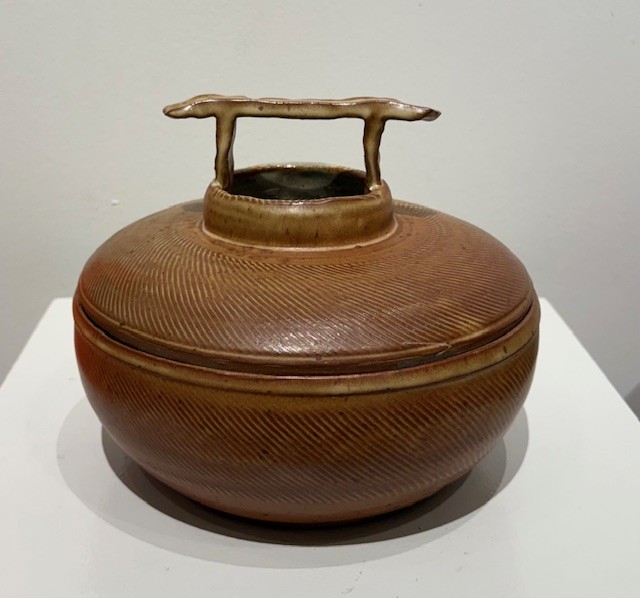 Carved vessel with lid by Harry Moxley